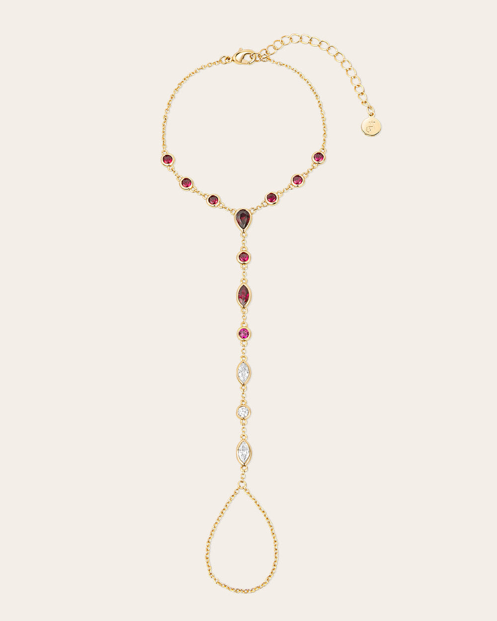 Pack shot of a gold hand chain with burgundy zirconia stones
