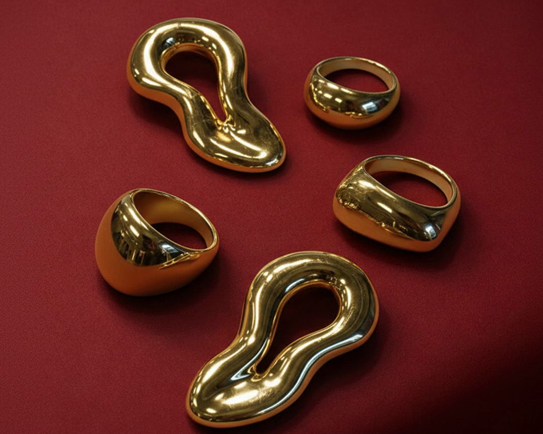 Product photo of the whole Italian drop. The three golden rings and the Valeria earrings.