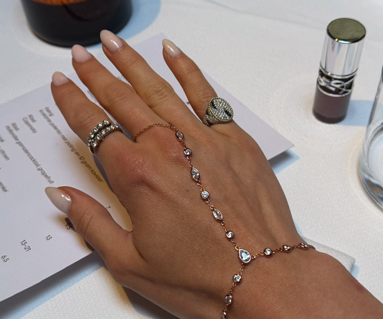 Aurelia hand chain styled with silver rings